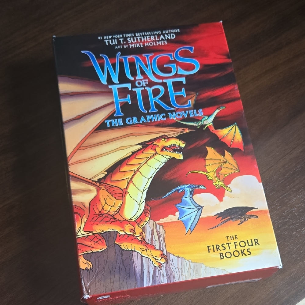 Scholastic Wings of Fire Graphic Novels with Red and Blue Dragons